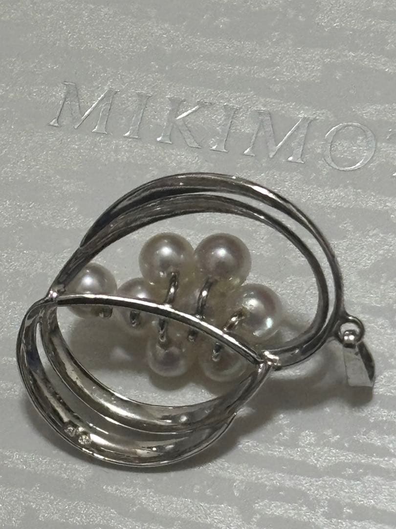 Mikimoto Pearl Pendant Top featuring 8 pearls in a circle motif with silver back stamp