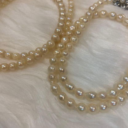Akoya and Freshwater Pearl Necklace set with silver clasps totaling 83 grams