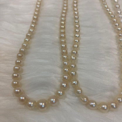 Akoya and Freshwater Pearl Necklace set with silver clasps totaling 83 grams