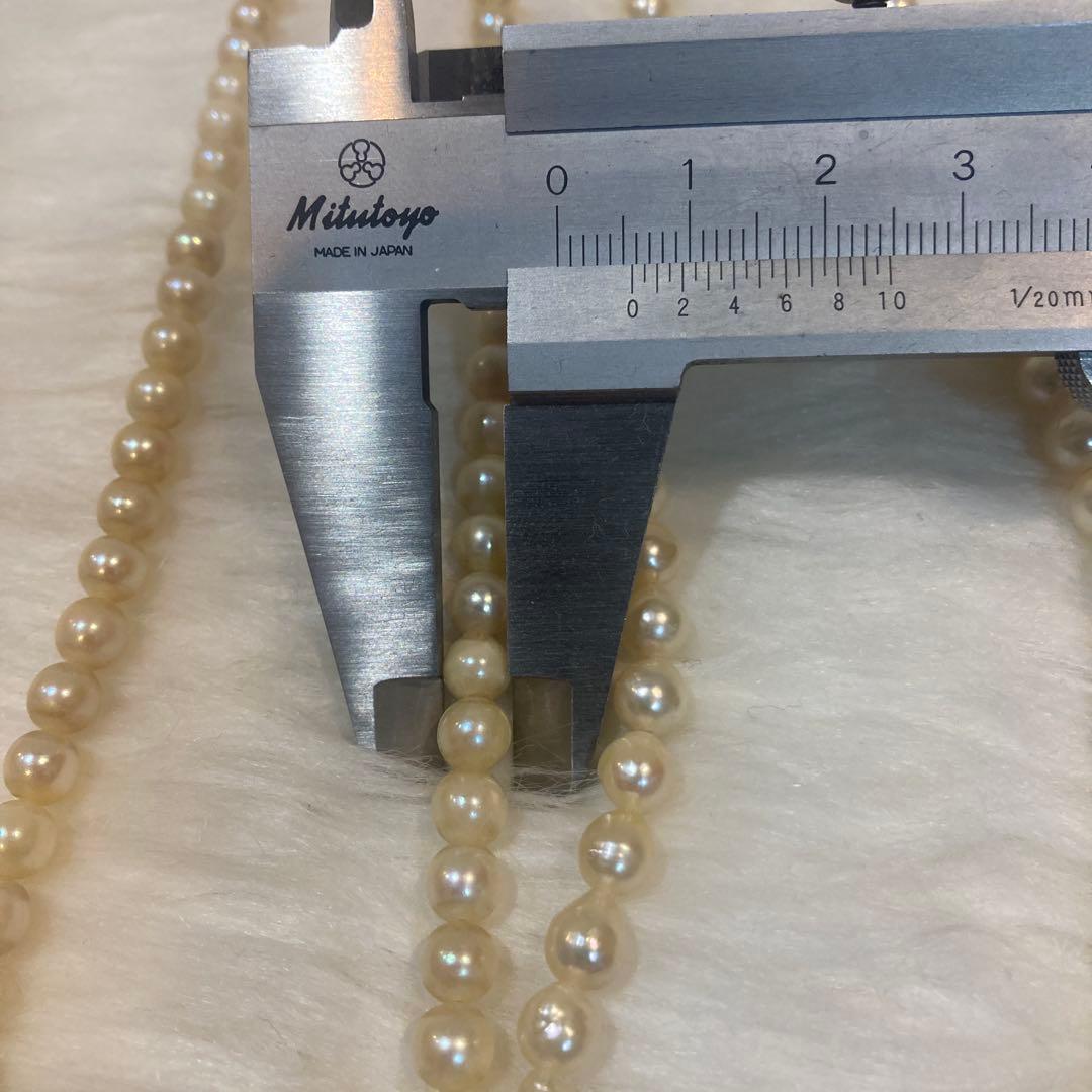 Akoya and Freshwater Pearl Necklace set with silver clasps totaling 83 grams