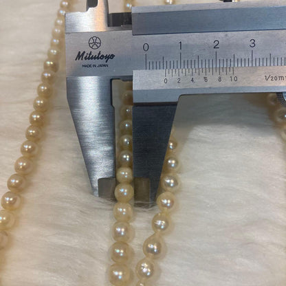 Akoya and Freshwater Pearl Necklace set with silver clasps totaling 83 grams