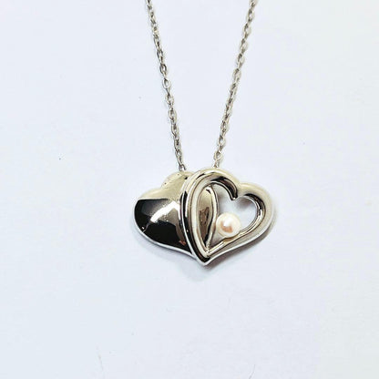 Mikimoto baby pearl necklace with 4.0 mm pearls and silver double heart pendant on a 40 cm chain