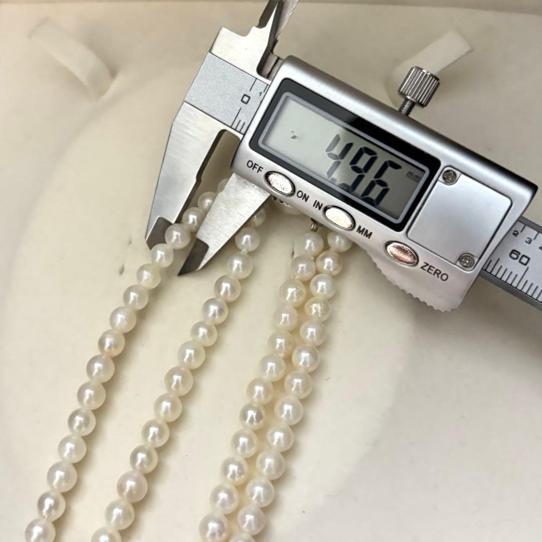 Two-strand necklace with white 5.5mm round Akoya baby pearls featuring silver mark