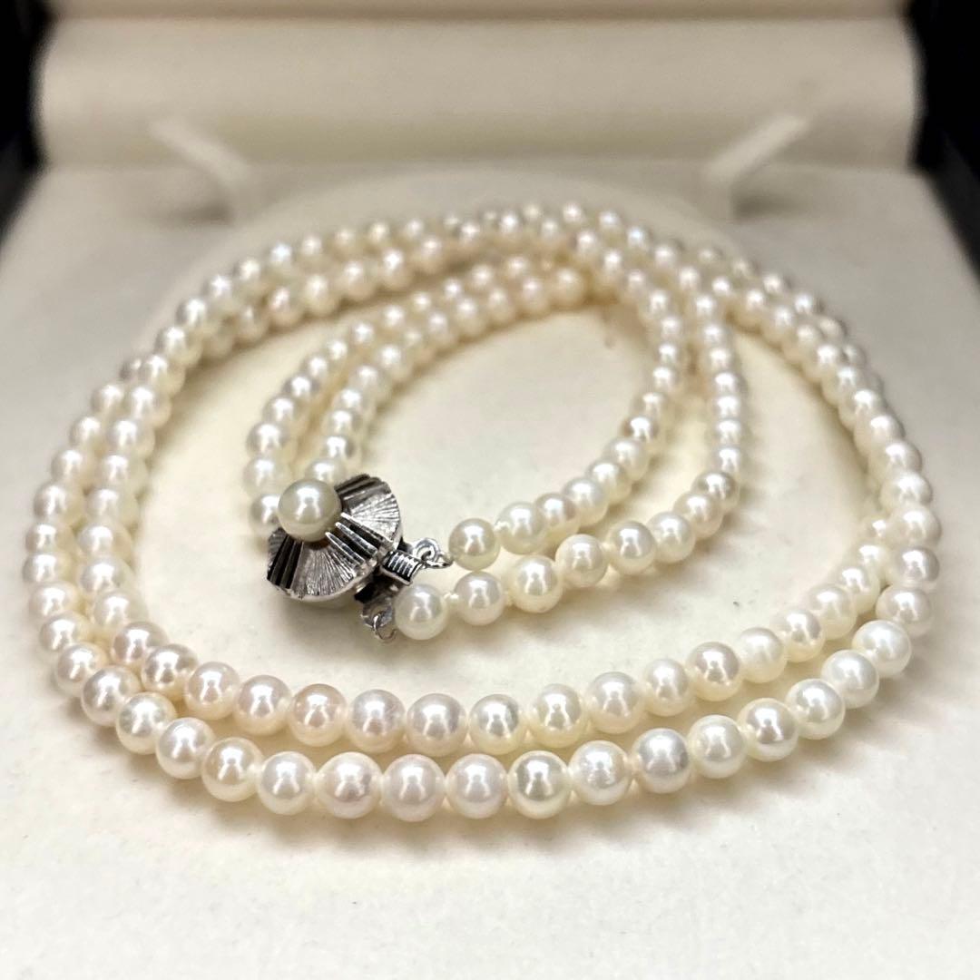 Two-strand necklace with white 5.5mm round Akoya baby pearls featuring silver mark