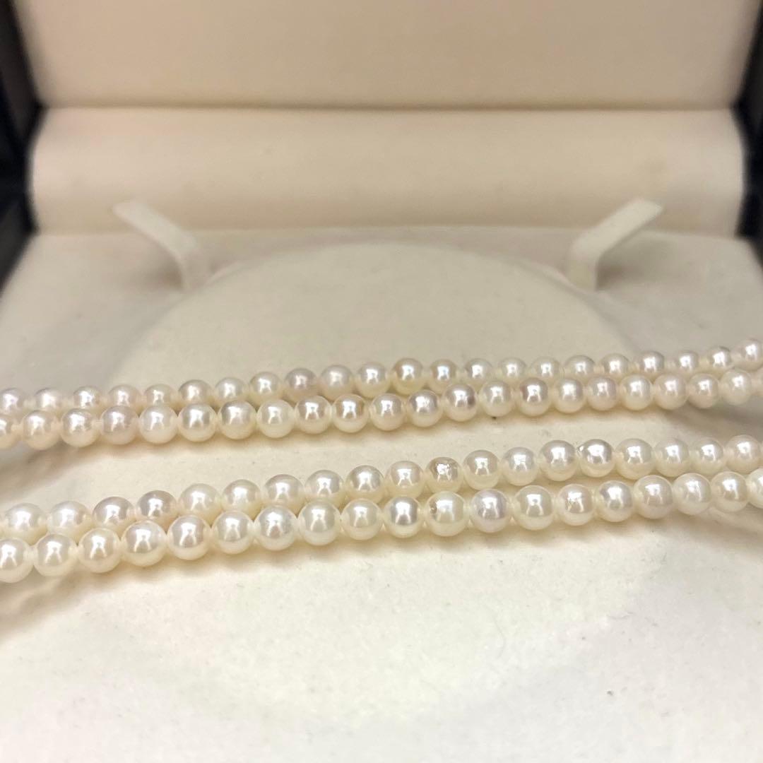 Two-strand necklace with white 5.5mm round Akoya baby pearls featuring silver mark