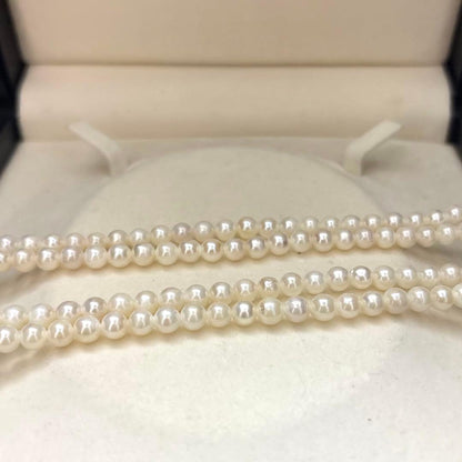 Two-strand necklace with white 5.5mm round Akoya baby pearls featuring silver mark