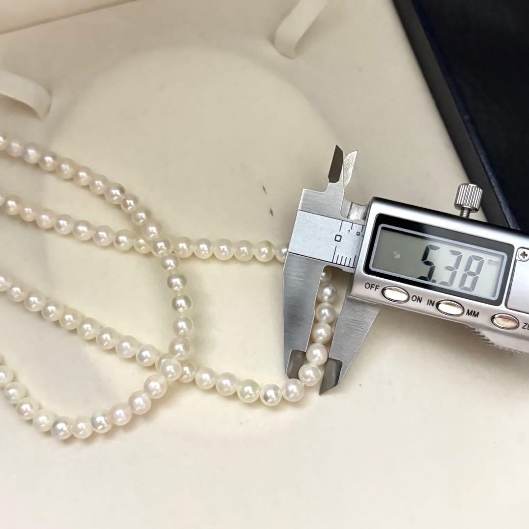Two-strand necklace with white 5.5mm round Akoya baby pearls featuring silver mark