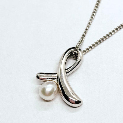 Tasaki Ribbon Pearl Necklace in silver with 40cm chain and 4.8mm pearl showing ribbon design