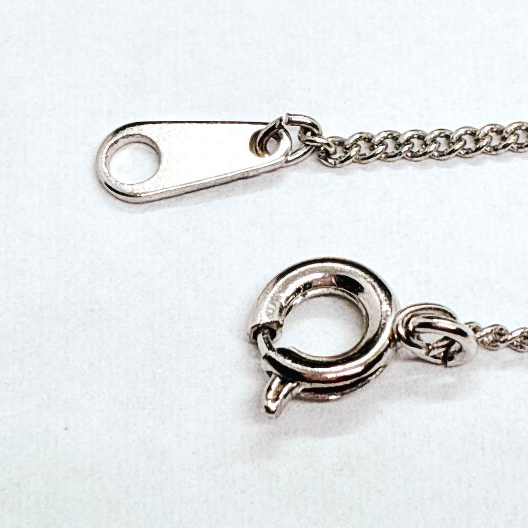 Tasaki Ribbon Pearl Necklace in silver with 40cm chain and 4.8mm pearl showing ribbon design