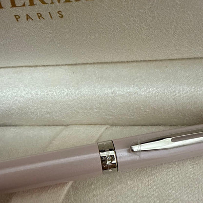 Waterman pink metal ballpoint pen with dedicated case on white background