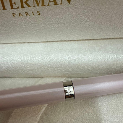 Waterman pink metal ballpoint pen with dedicated case on white background