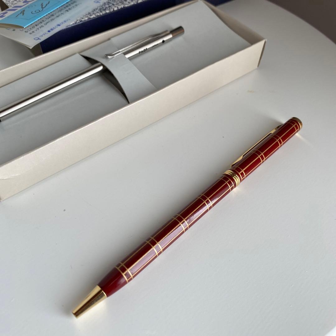 Pilot Pen mechanical pencil and ballpoint pen set with red pen and mechanical pencil showing signs of wear and dirt