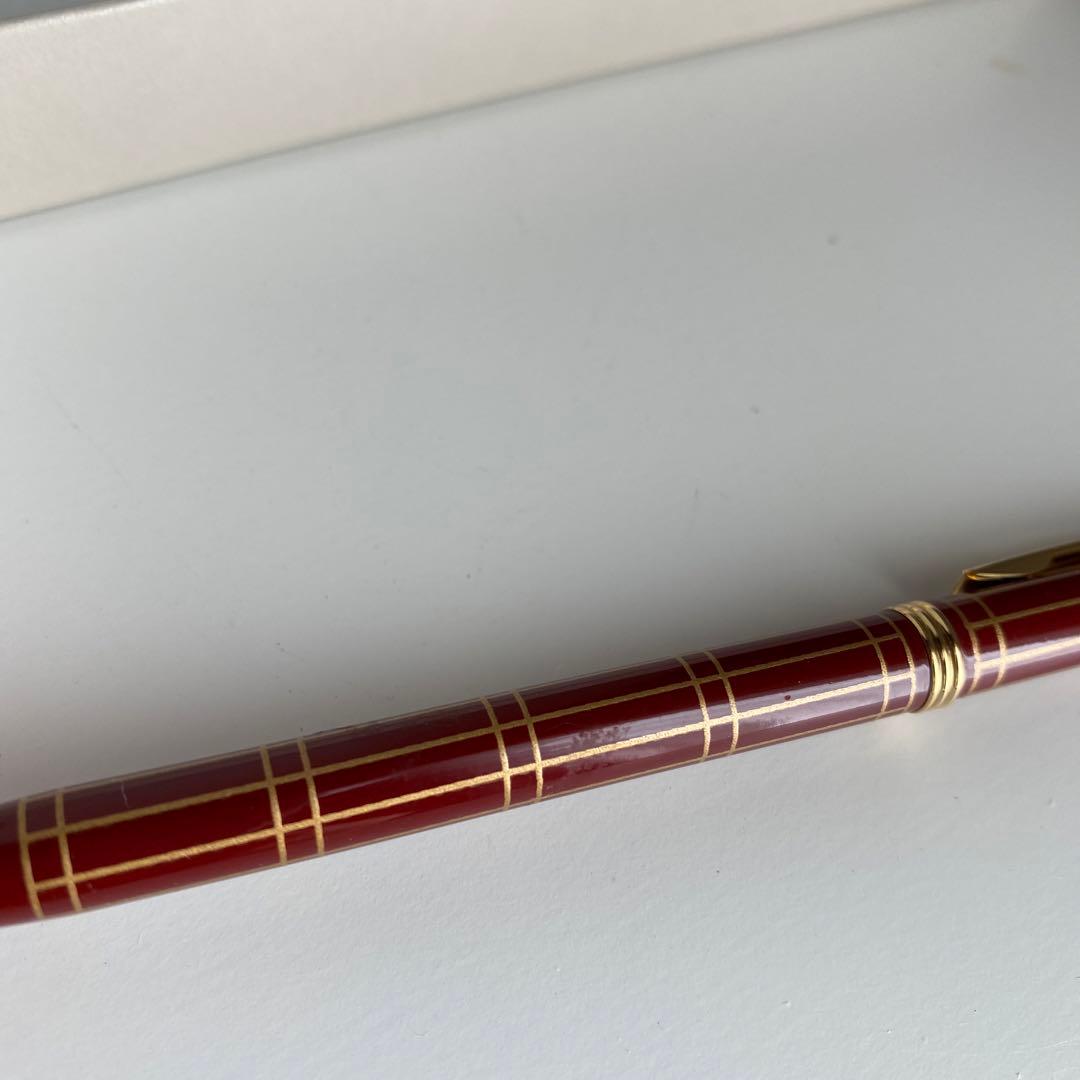 Pilot Pen mechanical pencil and ballpoint pen set with red pen and mechanical pencil showing signs of wear and dirt