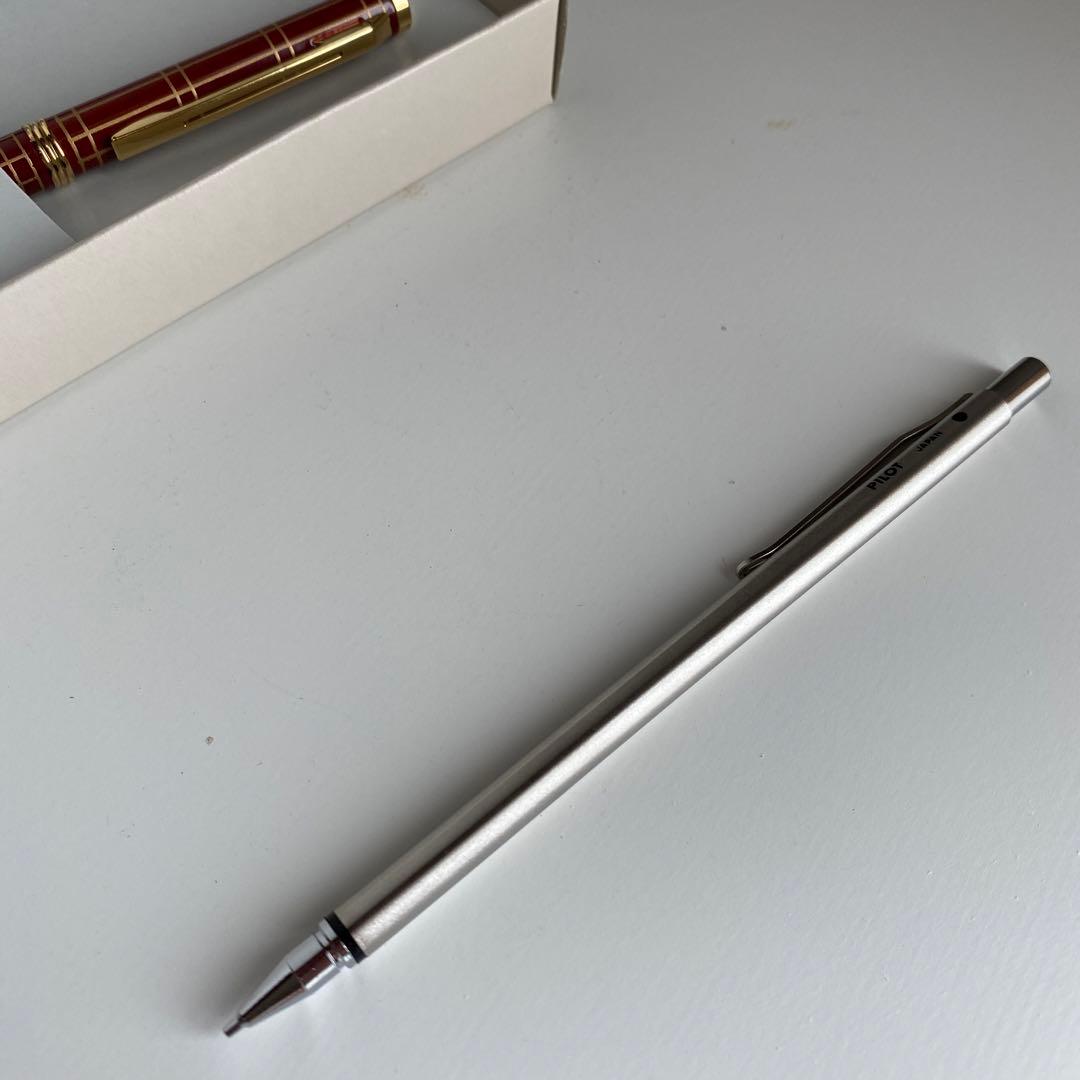 Pilot Pen mechanical pencil and ballpoint pen set with red pen and mechanical pencil showing signs of wear and dirt