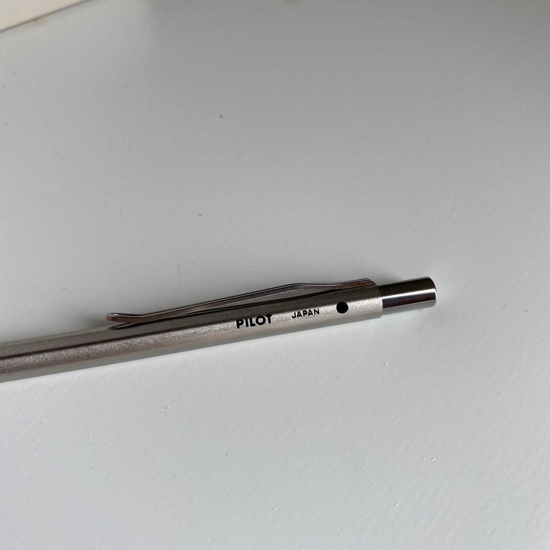 Pilot Pen mechanical pencil and ballpoint pen set with red pen and mechanical pencil showing signs of wear and dirt