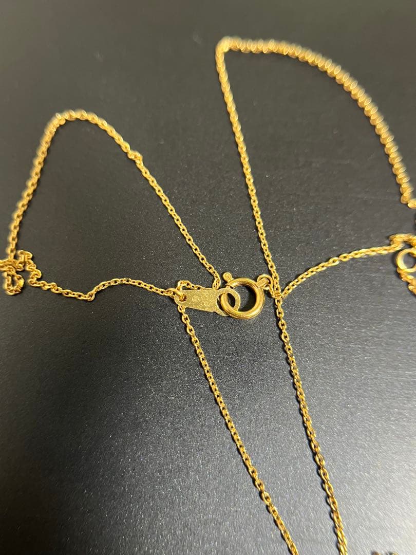TASAKI Akoya pearl necklace with diamond accents in 18K gold on a white background
