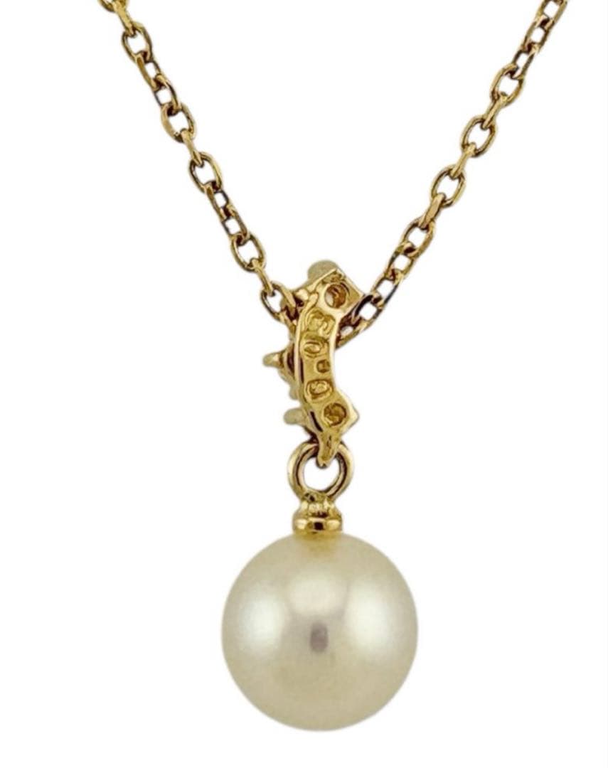 TASAKI Akoya pearl necklace with diamond accents in 18K gold on a white background