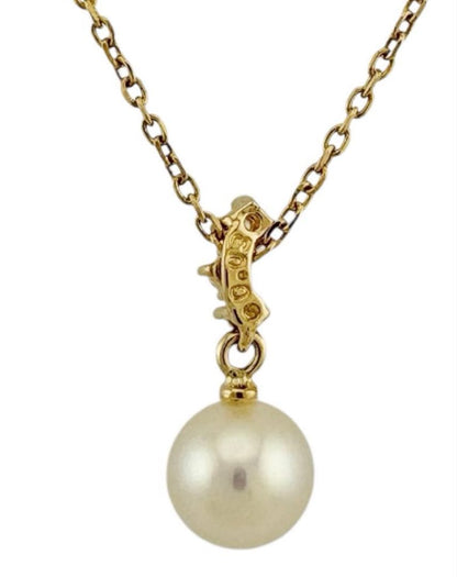 TASAKI Akoya pearl necklace with diamond accents in 18K gold on a white background