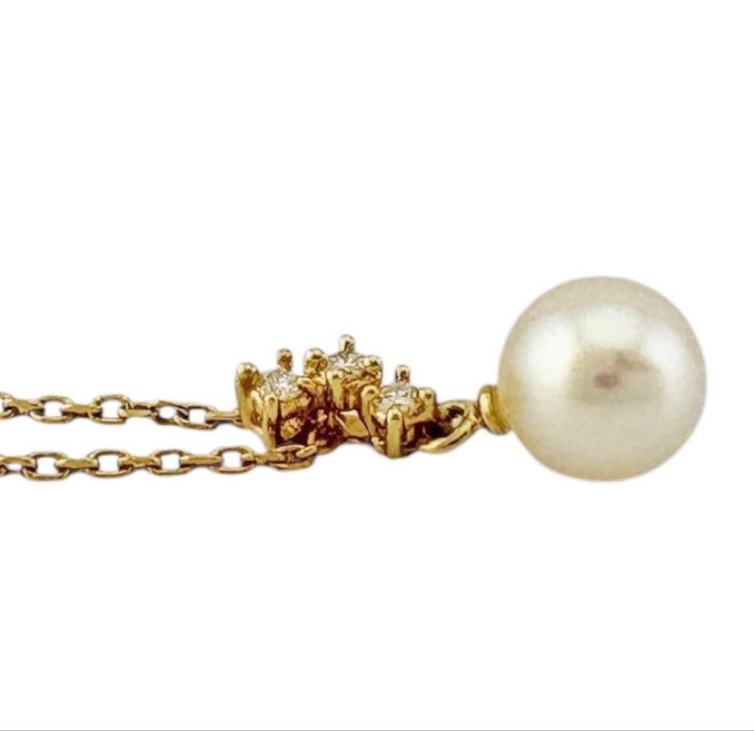 TASAKI Akoya pearl necklace with diamond accents in 18K gold on a white background