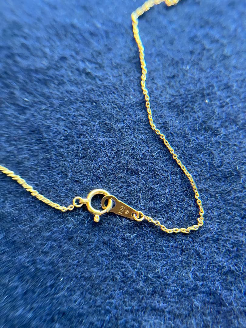 TASAKI Akoya pearl necklace with diamond accents in 18K gold on a white background
