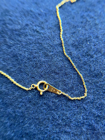 TASAKI Akoya pearl necklace with diamond accents in 18K gold on a white background