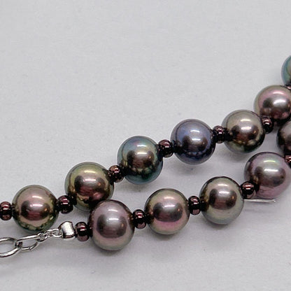 Akoya pearl necklace with baby black aurora pearls measuring 5.3-5.4mm on a 40cm chain