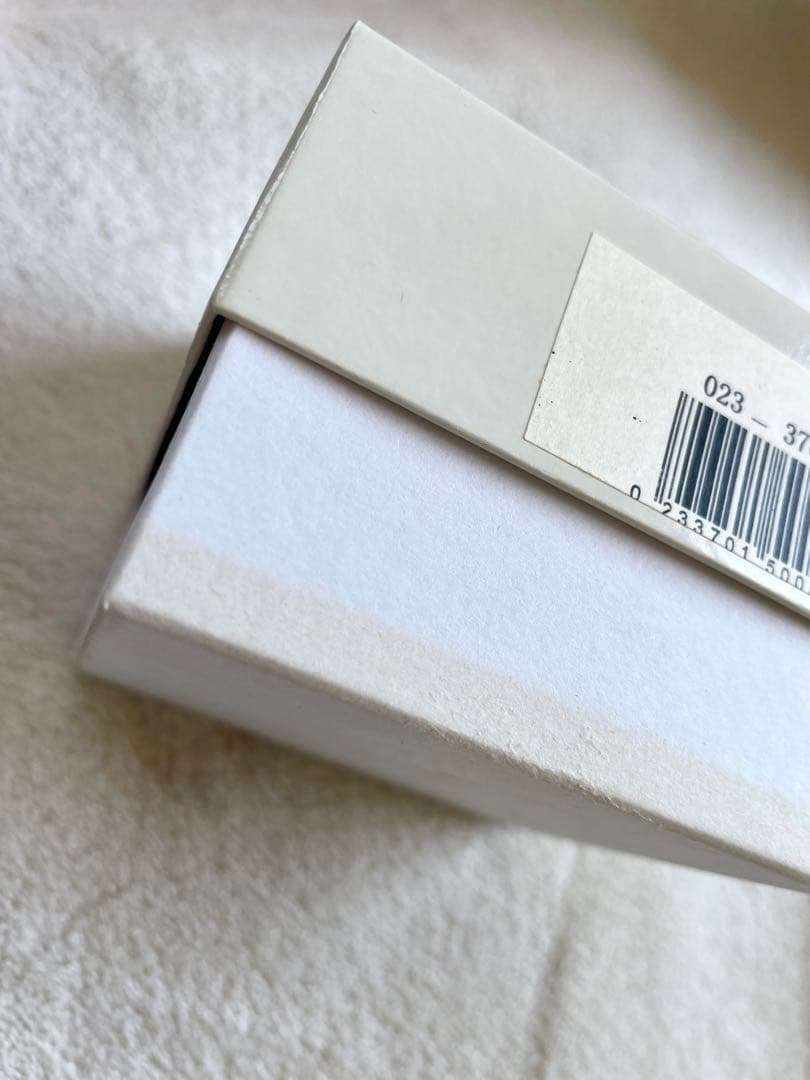 Used Tasaki pearl necklace with original box showing peeling and fading at bottom