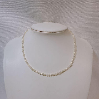 14K gold clasp Akoya baby pearl necklace with 2.8 to 3.3mm pearls on a 40cm chain