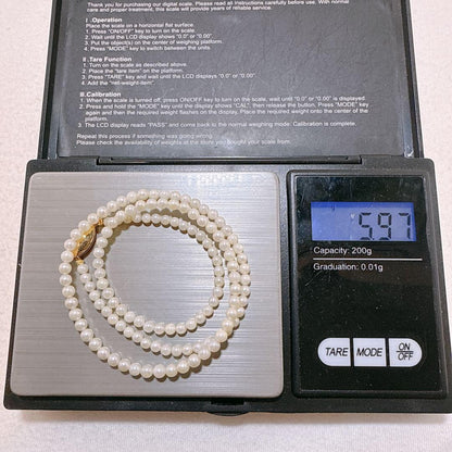 14K gold clasp Akoya baby pearl necklace with 2.8 to 3.3mm pearls on a 40cm chain