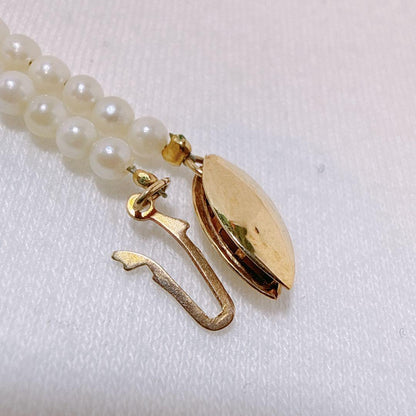 14K gold clasp Akoya baby pearl necklace with 2.8 to 3.3mm pearls on a 40cm chain