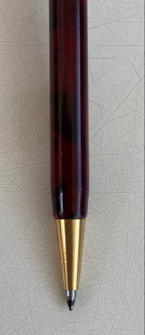 Set of 4 vintage PILOT Laureate ballpoint pens in pink, Bordeaux, and Bordeaux marble colors with visible aging