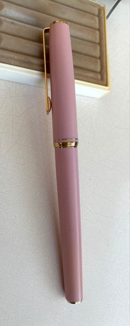 Set of 4 vintage PILOT Laureate ballpoint pens in pink, Bordeaux, and Bordeaux marble colors with visible aging
