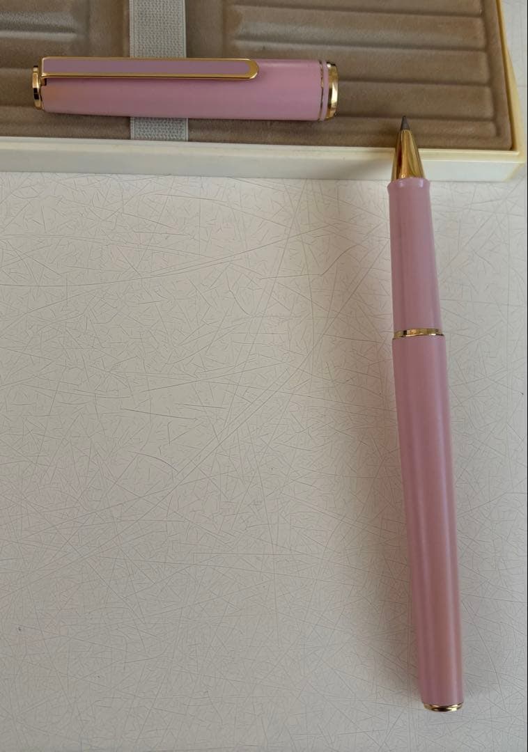 Set of 4 vintage PILOT Laureate ballpoint pens in pink, Bordeaux, and Bordeaux marble colors with visible aging