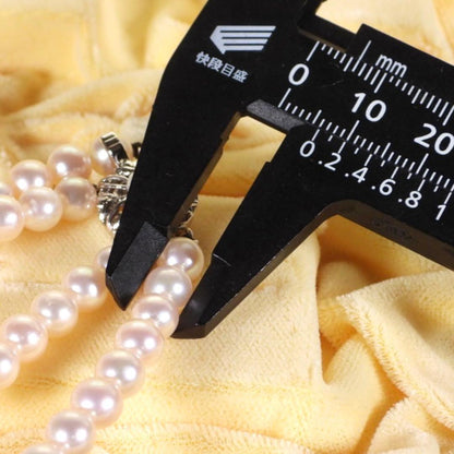 Akoya genuine pearl long necklace featuring two rows of flower pearl inclusions on a white background