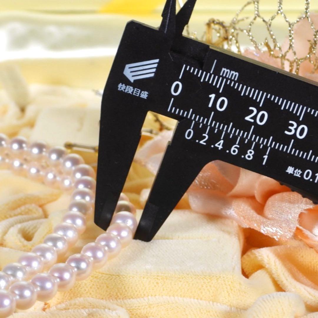 Akoya genuine pearl long necklace featuring two rows of flower pearl inclusions on a white background