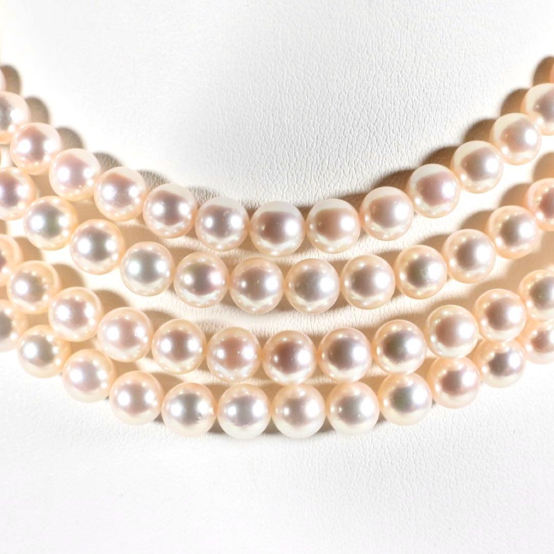 Akoya genuine pearl long necklace featuring two rows of flower pearl inclusions on a white background