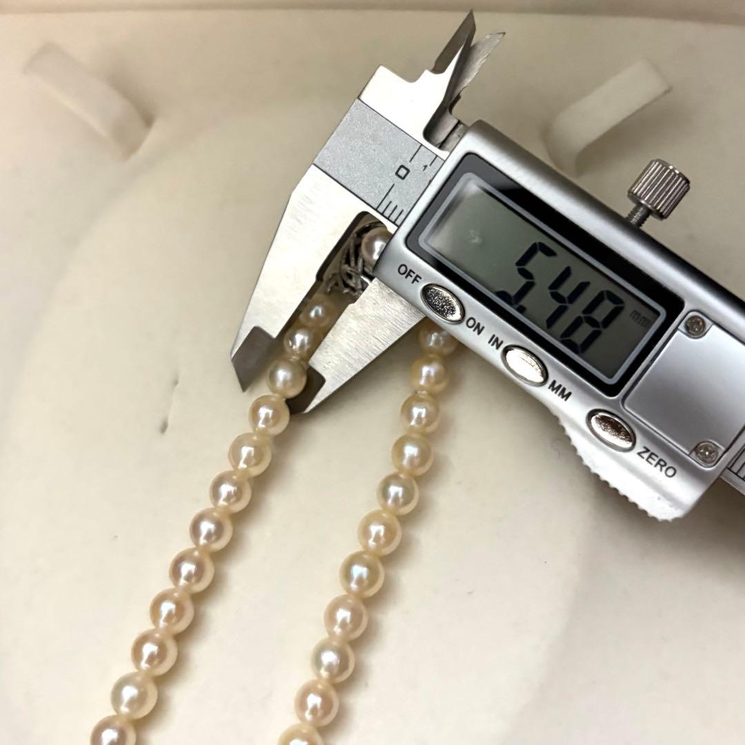 Long 107cm triple-strand Akoya pearl necklace with 6mm white pearls weighing 51 grams