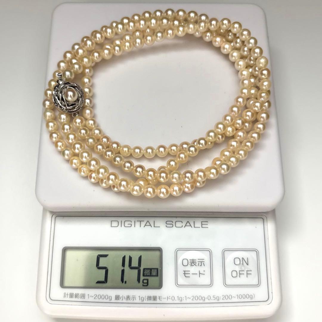 Long 107cm triple-strand Akoya pearl necklace with 6mm white pearls weighing 51 grams