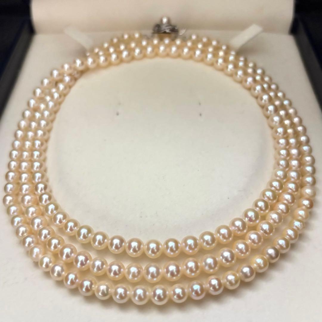Long 107cm triple-strand Akoya pearl necklace with 6mm white pearls weighing 51 grams