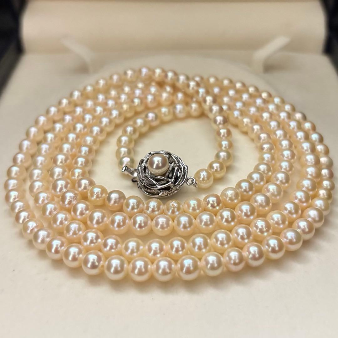 Long 107cm triple-strand Akoya pearl necklace with 6mm white pearls weighing 51 grams
