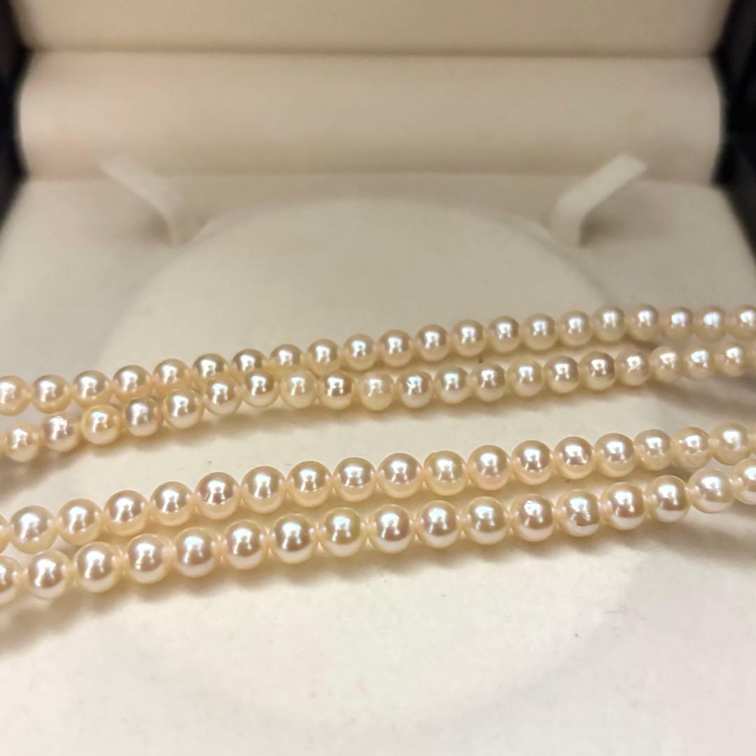 Long 107cm triple-strand Akoya pearl necklace with 6mm white pearls weighing 51 grams