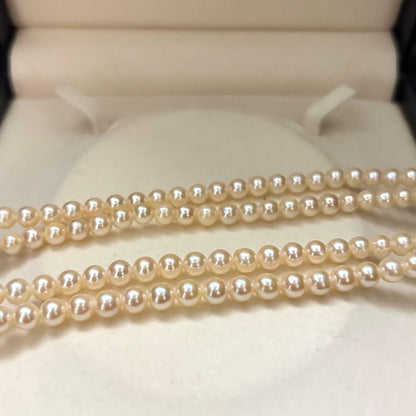 Long 107cm triple-strand Akoya pearl necklace with 6mm white pearls weighing 51 grams