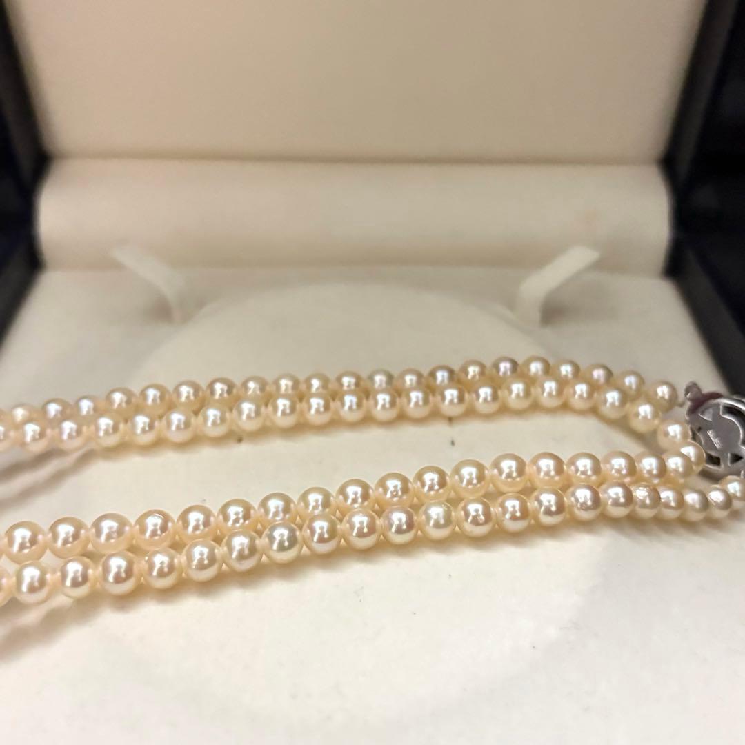 Long 107cm triple-strand Akoya pearl necklace with 6mm white pearls weighing 51 grams