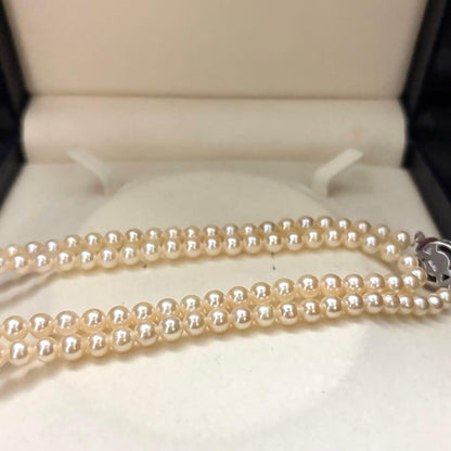 Long 107cm triple-strand Akoya pearl necklace with 6mm white pearls weighing 51 grams