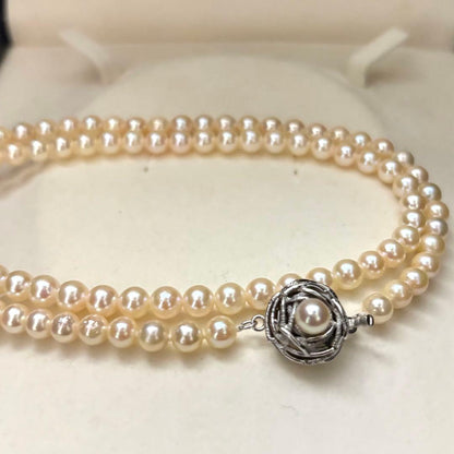 Long 107cm triple-strand Akoya pearl necklace with 6mm white pearls weighing 51 grams