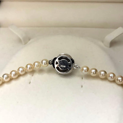 Long 107cm triple-strand Akoya pearl necklace with 6mm white pearls weighing 51 grams