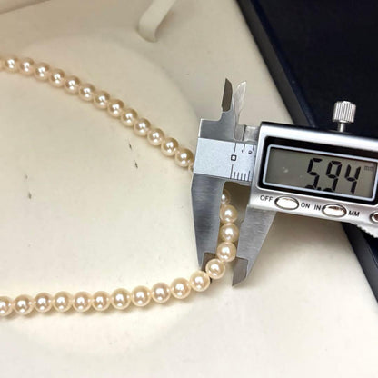 Long 107cm triple-strand Akoya pearl necklace with 6mm white pearls weighing 51 grams