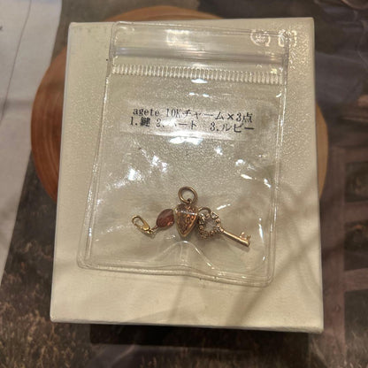 Agete 10K gold heart and key charms 3-piece set with diamond and ruby accents in gold color