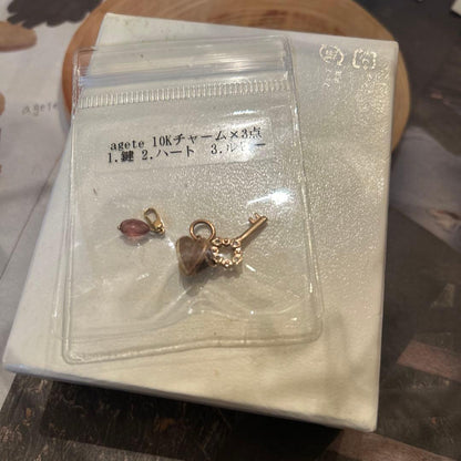Agete 10K gold heart and key charms 3-piece set with diamond and ruby accents in gold color