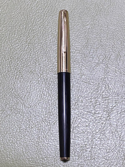 Pilot 14k Fountain Pen in gold finish showcasing nib and cap for premium writing